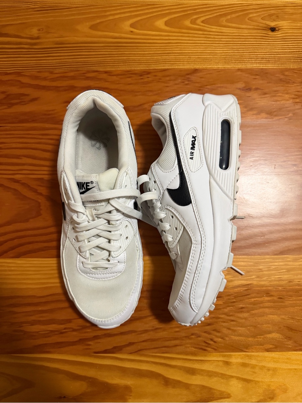 Nike Women's White Sneakers with Black Swoosh